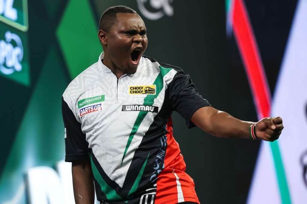 David Munyua celebrates his historic World Darts Championship victory, after becoming the first Kenyan to win a match at the PDC tournament.