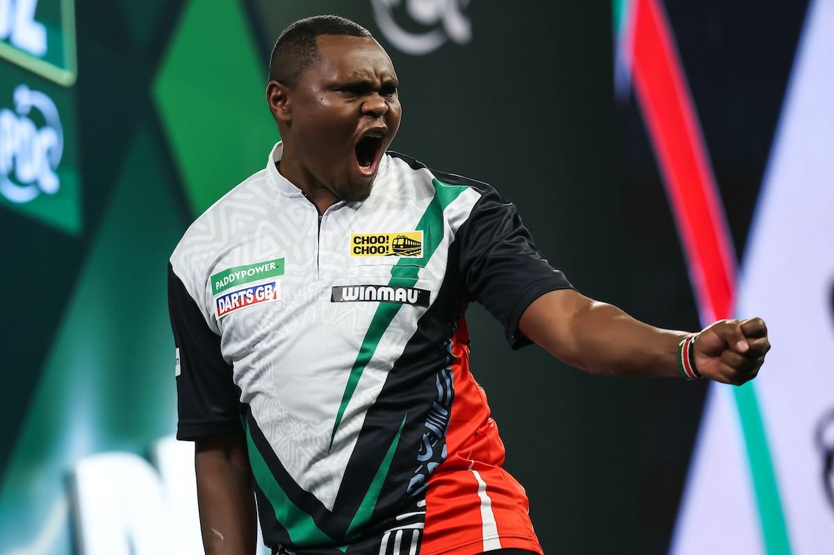 David Munyua celebrates his historic World Darts Championship victory, after becoming the first Kenyan to win a match at the PDC tournament.
